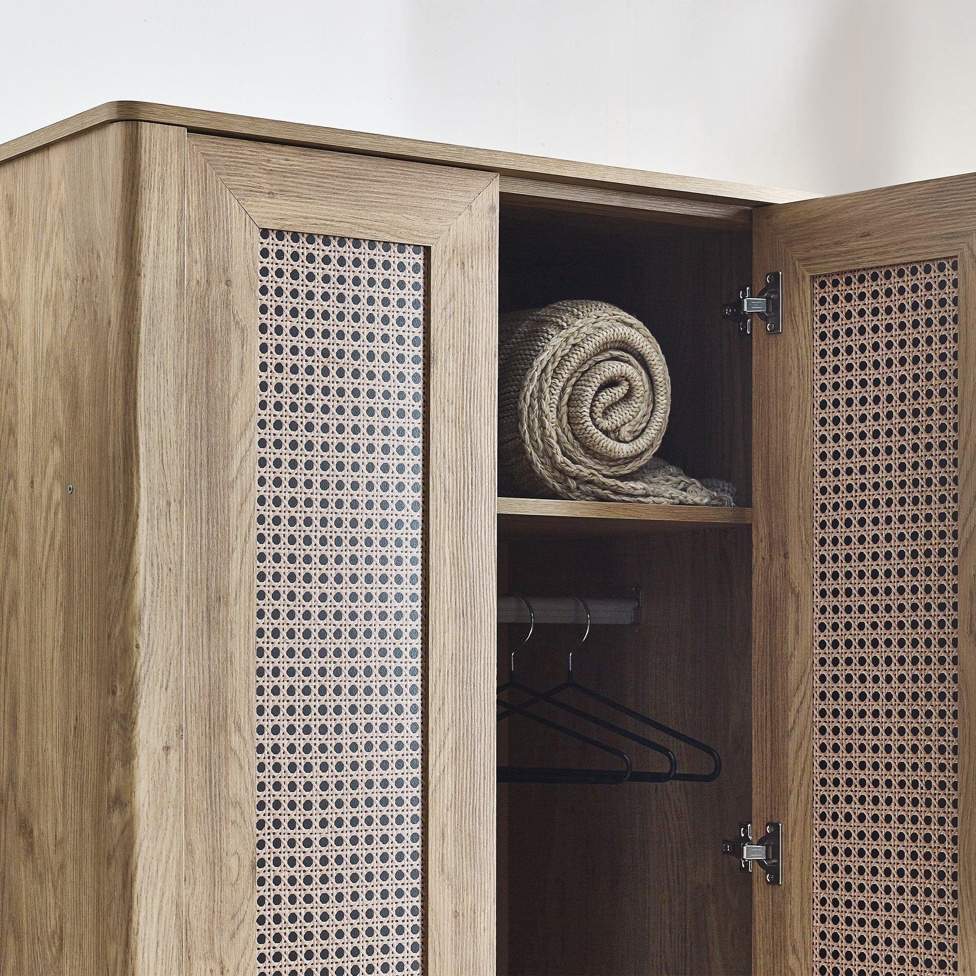 Sydney rattan effect wardrobe open to show shelf, rail and cane panel doors