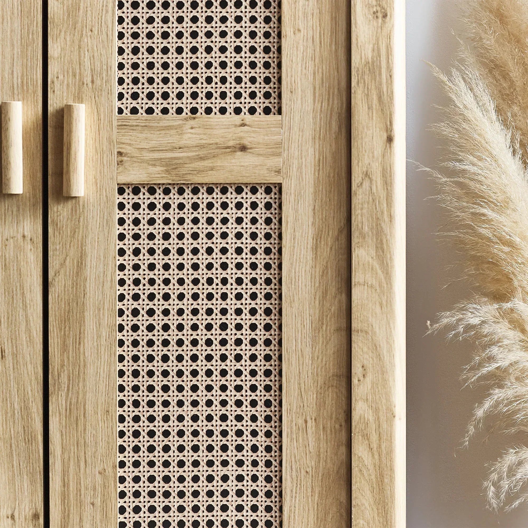 Rattan effect wardrobe doors with wooden handles and detailed woven panel closeup