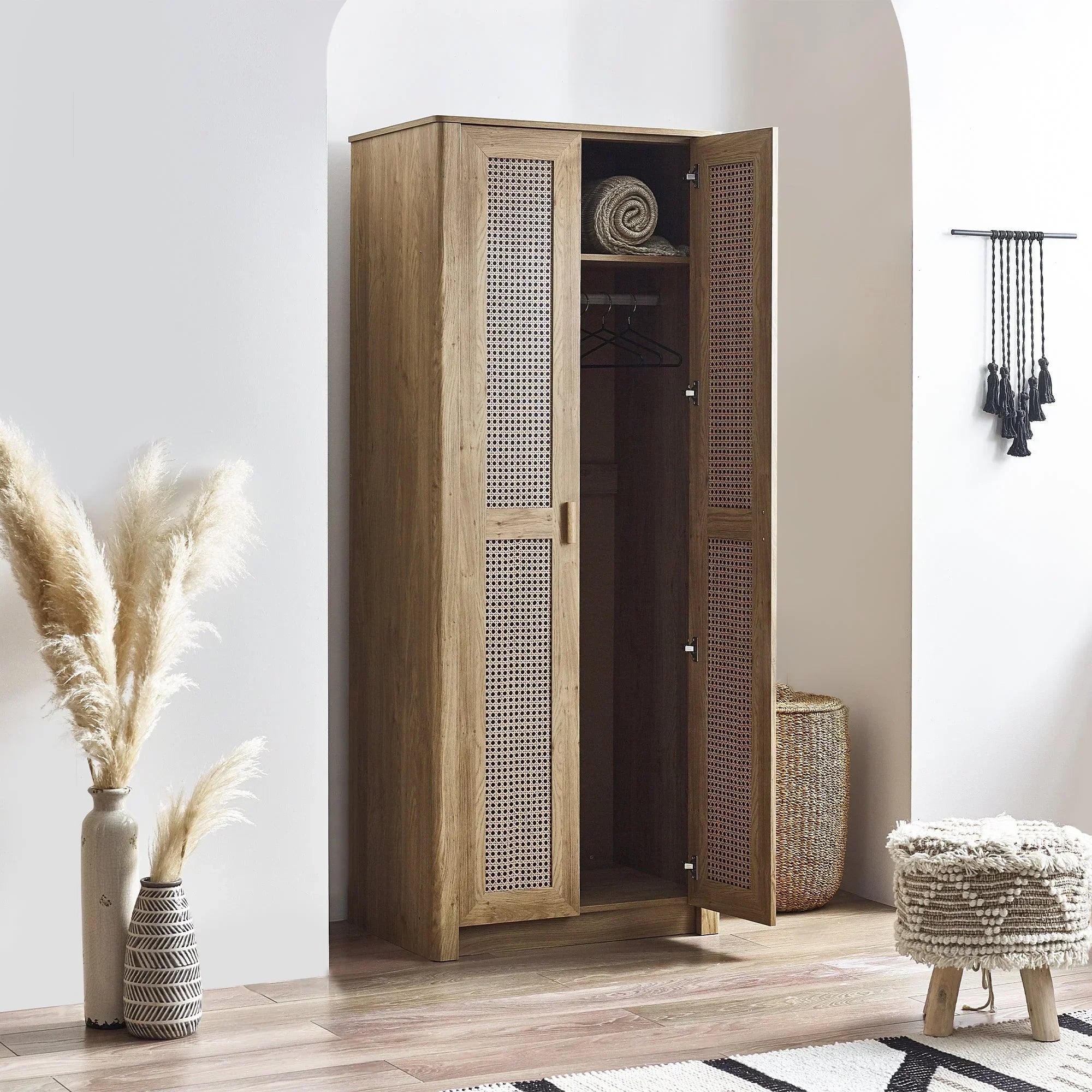Sydney rattan effect wardrobe with open doors, natural finish, styled in modern room