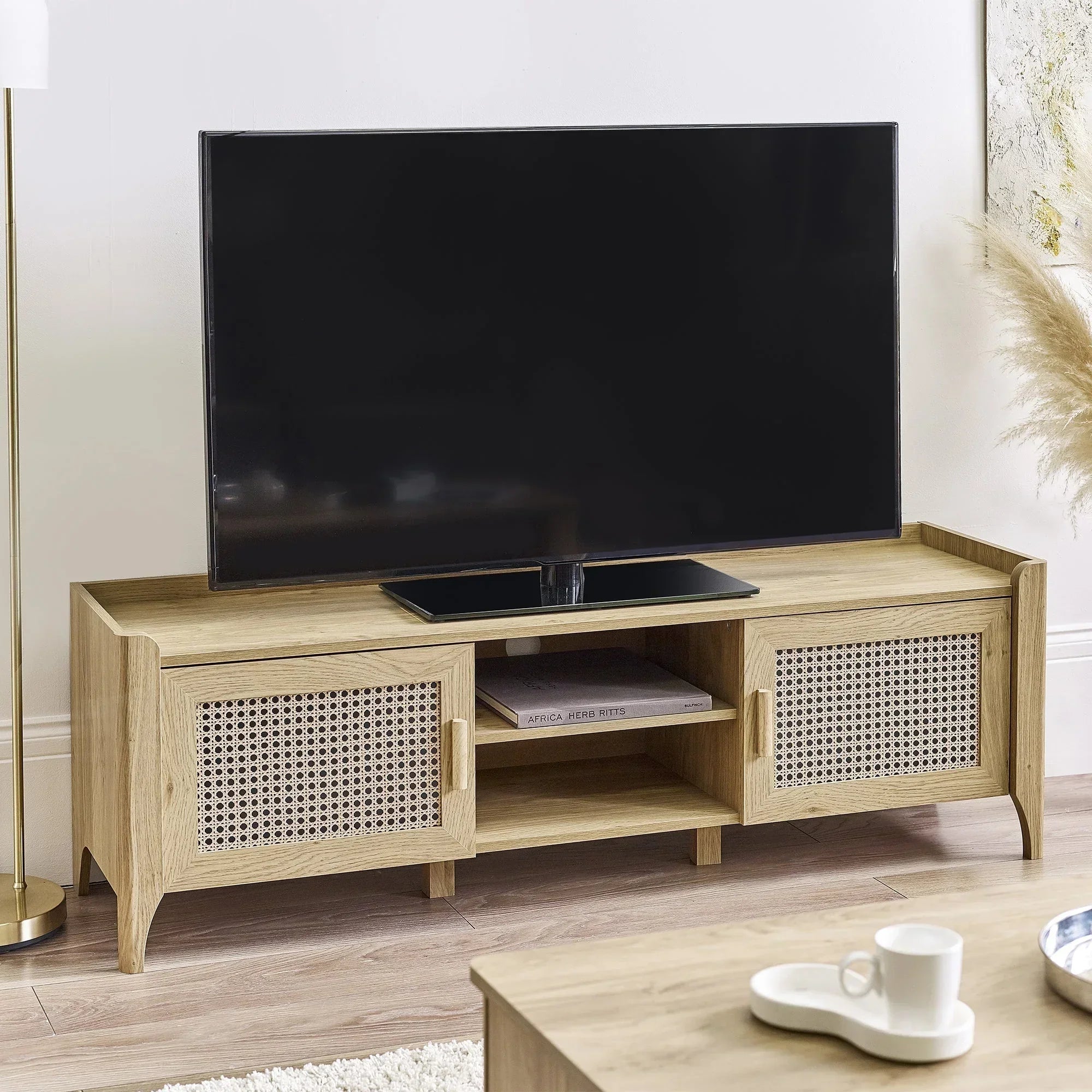 Sydney rattan effect media unit with natural wood finish used as TV stand in living room