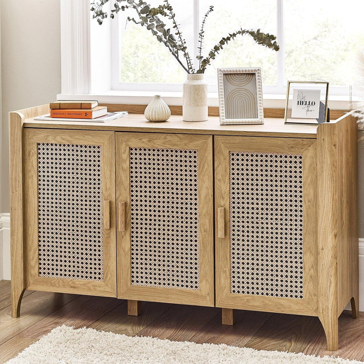 Sydney rattan effect 3 door sideboard in light wood with decor in bright living room