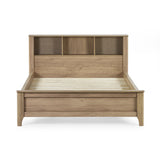 Front view of oak wood bed frame with slatted base and built-in shelving in headboard on white background