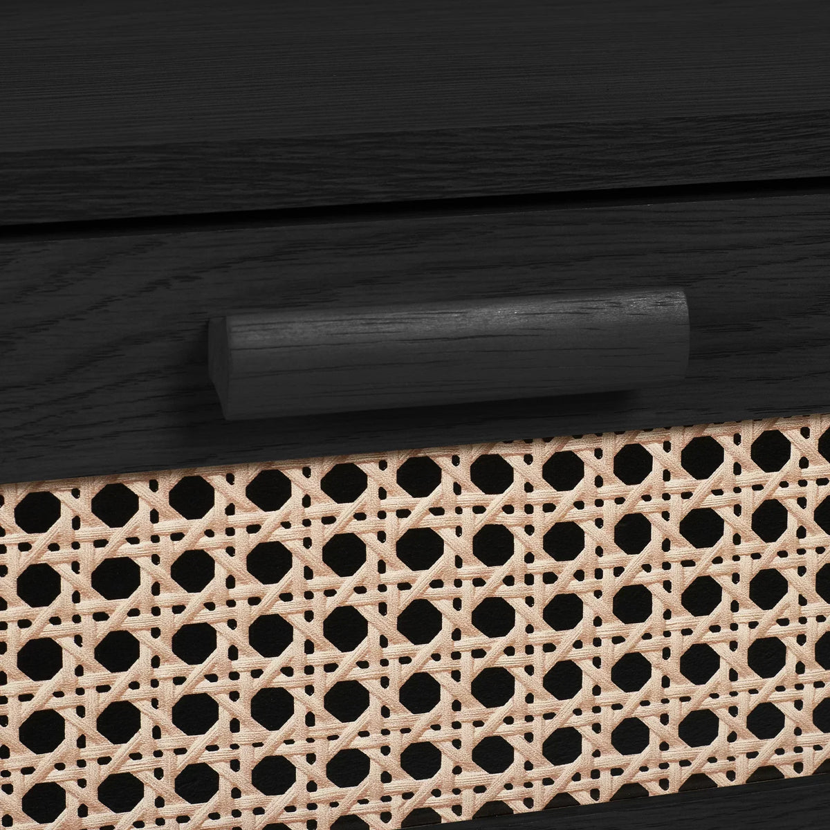 Close-up of black ash rattan effect drawer handle and woven front panel on chest