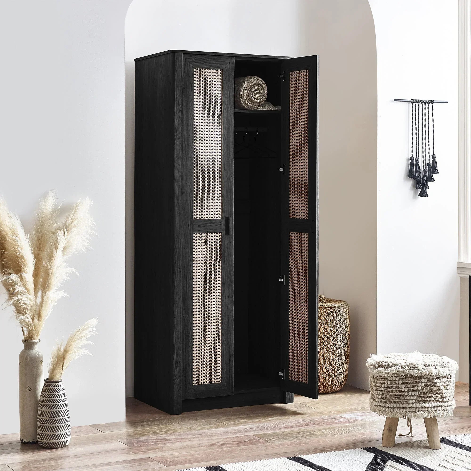 Black rattan effect 2 door wardrobe with open doors in bright modern bedroom setting