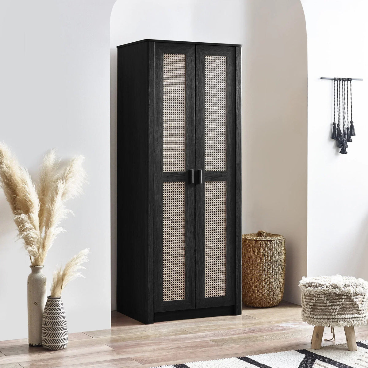 Black rattan effect 2 door wardrobe in modern room with woven basket and pampas grass