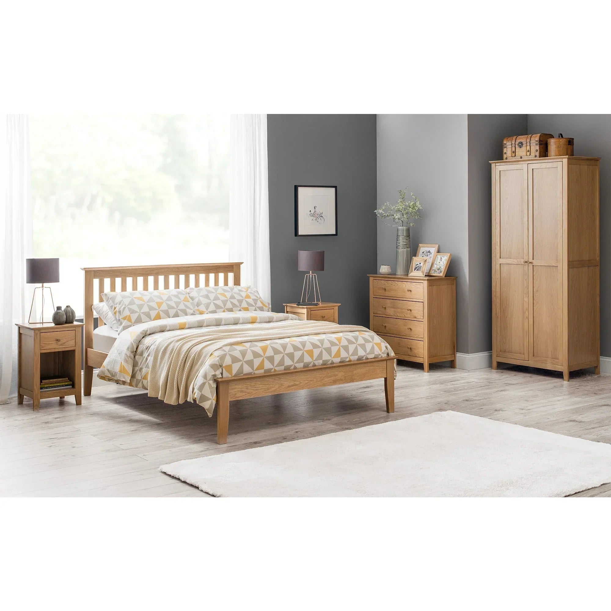Oak bedroom furniture set with wooden bed, wardrobe, nightstands, and chest of drawers