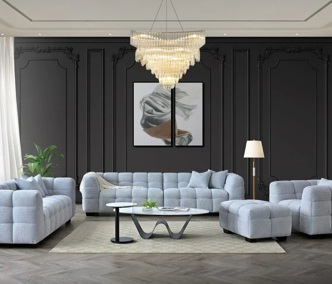 Light grey modular sofa set with matching ottoman in modern living room with chandelier