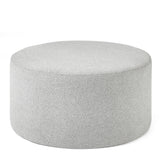 Round grey footstool upholstered in fabric with minimalist design on white background