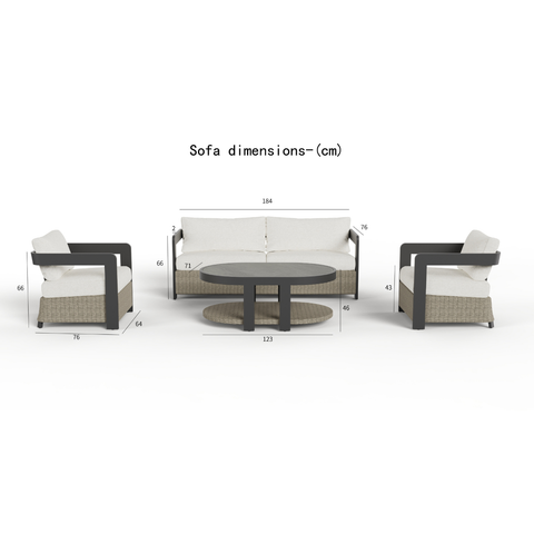 Light beige cushioned seating with dark brown woven base and black armrests alongside round table