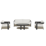 Beige woven rattan seating with light cream cushions and black metal framed coffee table