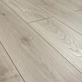 Silver oak laminate flooring planks with natural wood grain texture, close-up view