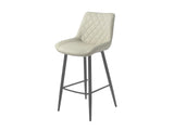 Taupe bar stool with diamond-stitched seat and black metal legs on white background