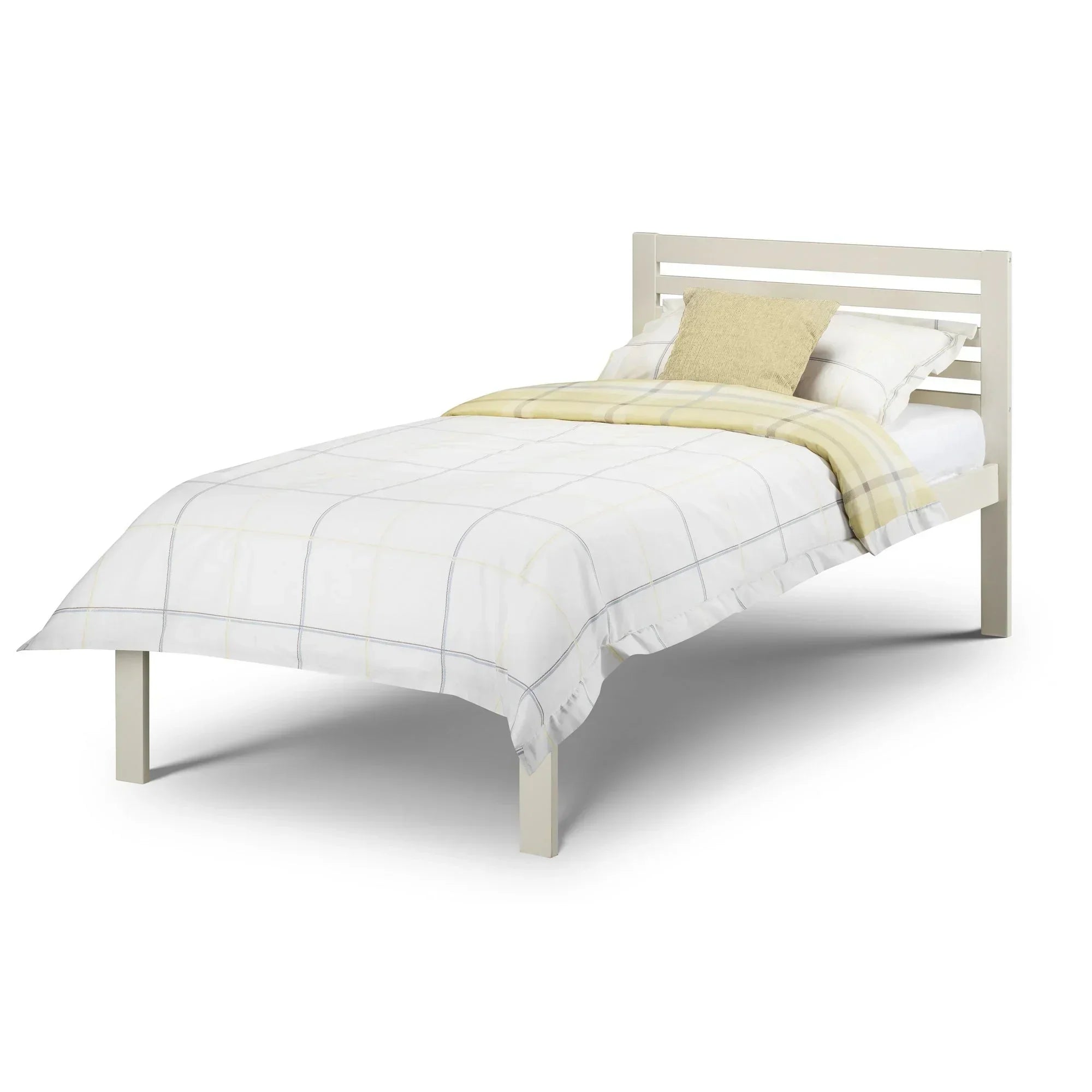 Single stone white bed frame with slatted headboard, dressed in light plaid bedding