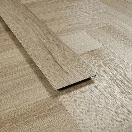 Smokey oak vinyl flooring plank on herringbone pattern laminate floor