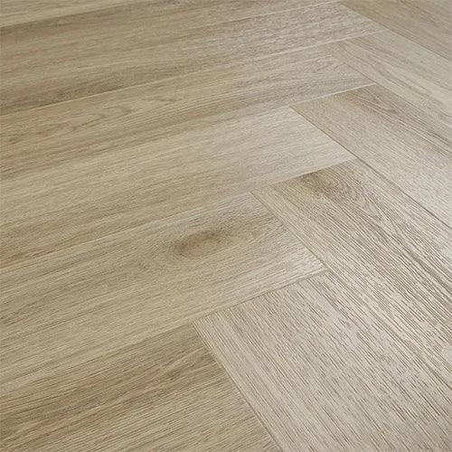 Smokey Oak herringbone laminate flooring with natural wood grain texture, angled view