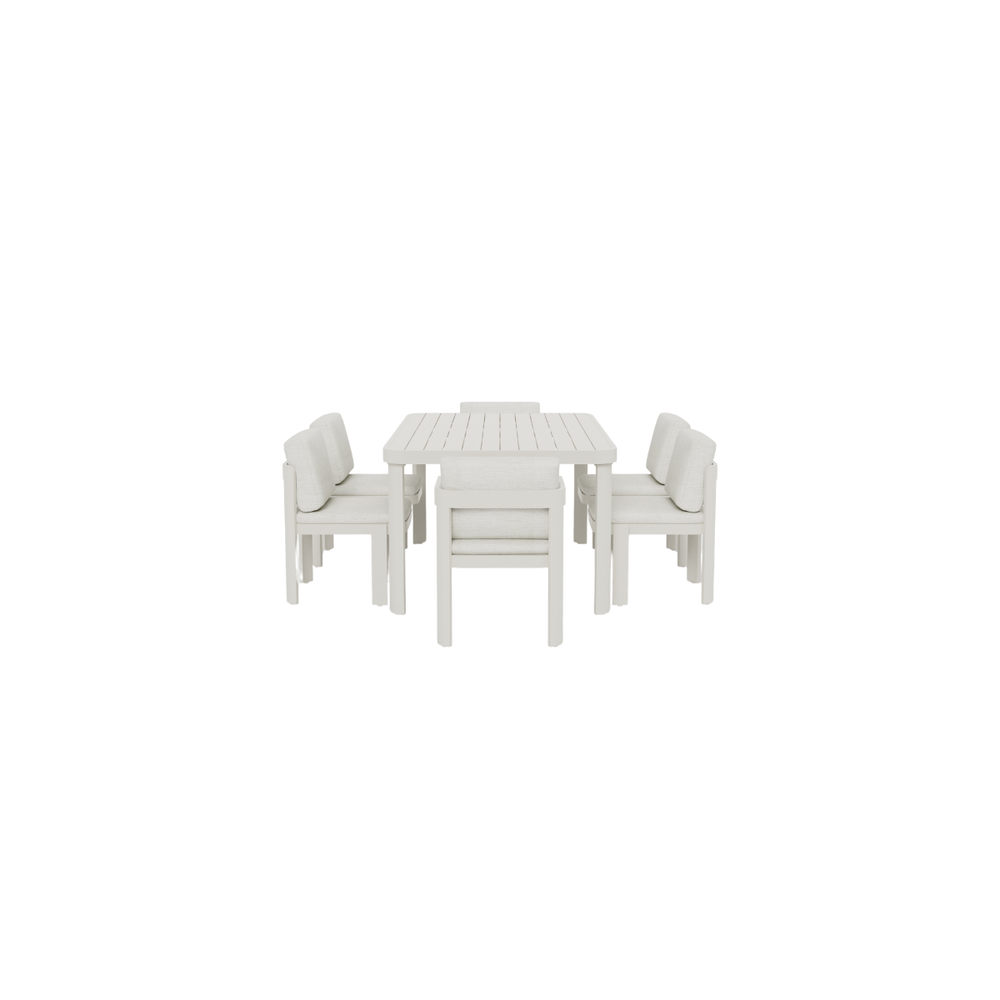 White wooden dining table with six upholstered cushioned chairs arranged evenly
