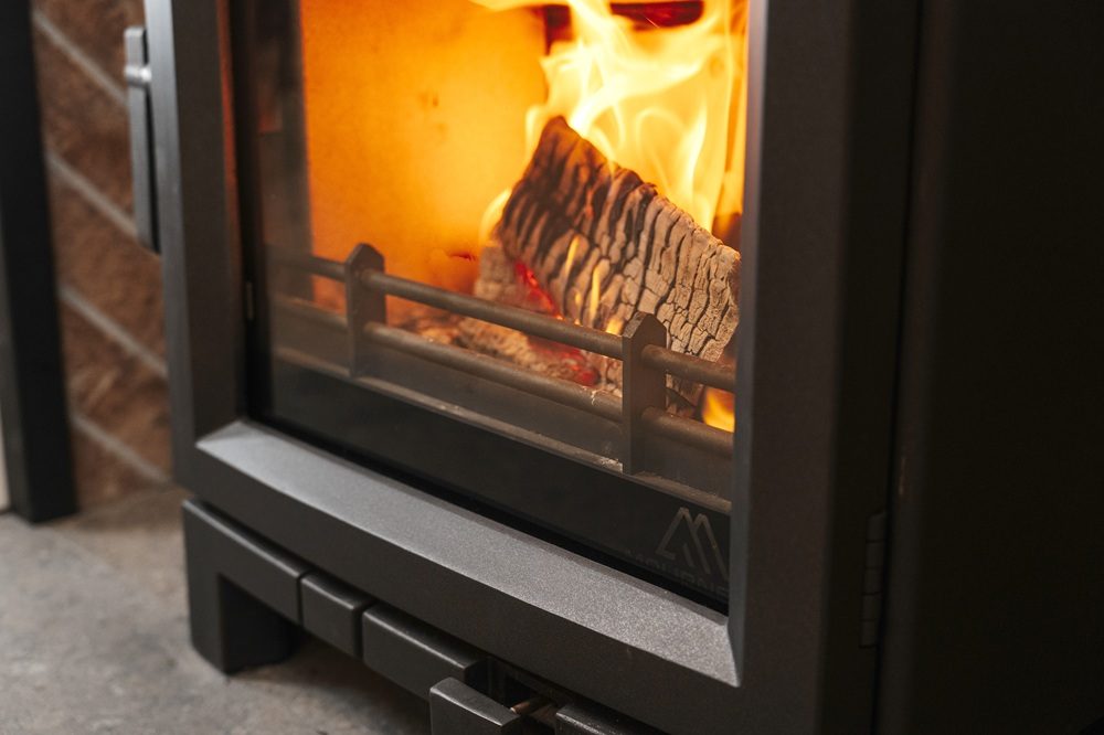 Mourne Summit 5 LS stove showing integrated air controls and log store