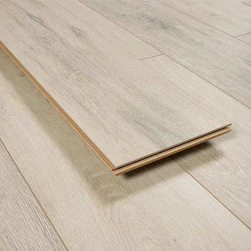 Sunbleached oak flooring plank with wood grain texture on light laminate floor
