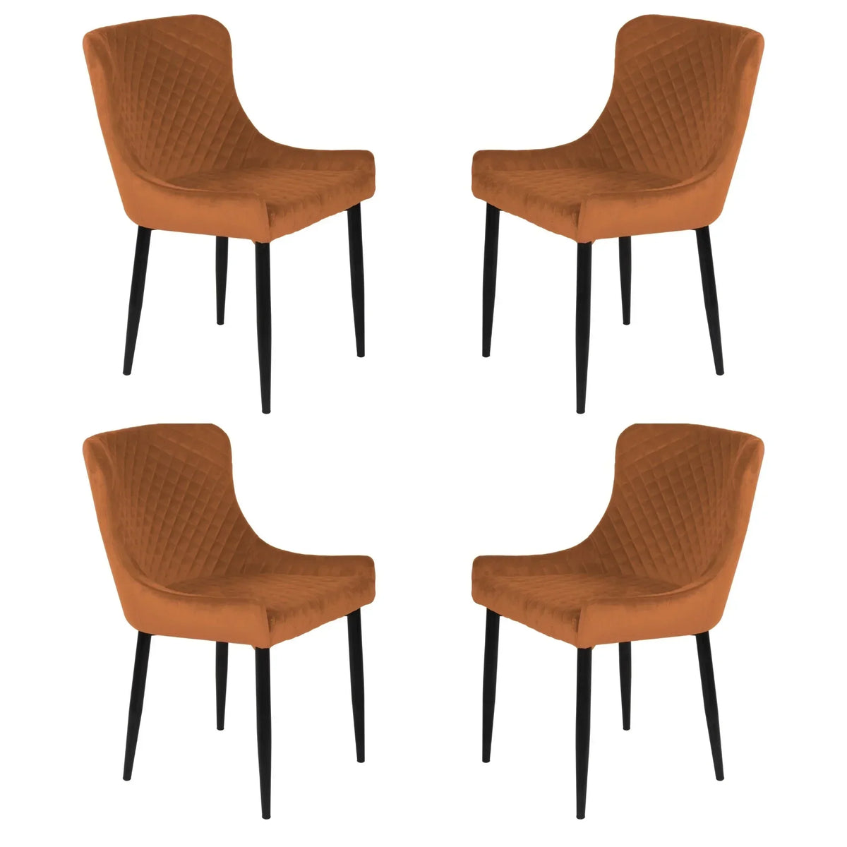 Set of four orange velvet dining chairs with quilted backs and black legs on white background