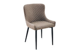 A modern dining chair upholstered in taupe quilted velvet with slim black metal legs, shown against a plain white background.