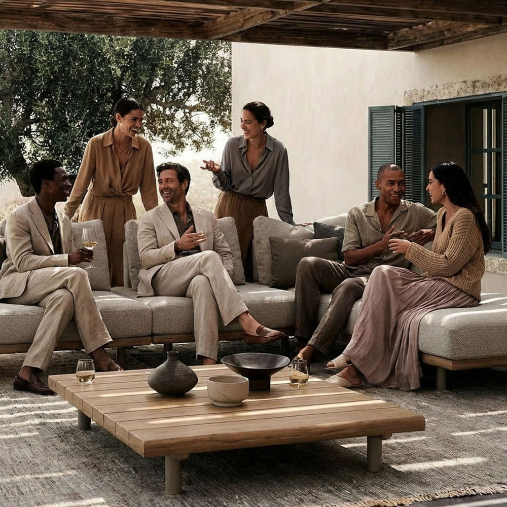 Image of Large group of people relaxing on a modern grey outdoor lounging set