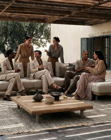 Image of Large group of people relaxing on a modern grey outdoor lounging set