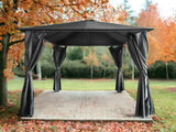 Black metal outdoor gazebo with tied curtains on patio in garden with autumn trees