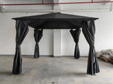 Black garden gazebo with canopy roof and tied curtains, shown in indoor warehouse setting