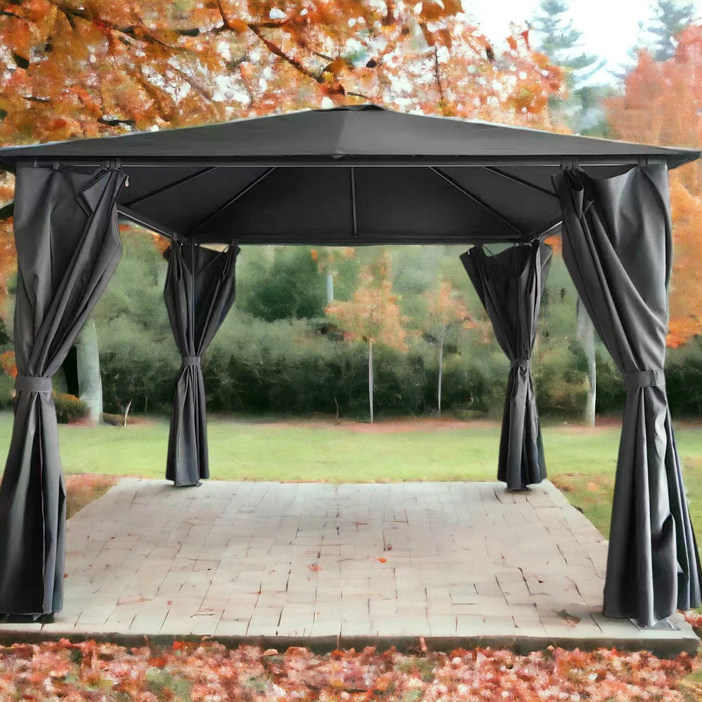 Black metal garden gazebo with tied waterproof curtains on patio, autumn trees in background