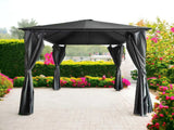 Black outdoor garden gazebo with curtains on patio, surrounded by hedges and flowers