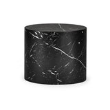 Large black oval table with white marble veining on white background, cylindrical shape