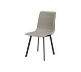 A modern dining chair with a light taupe upholstered seat and backrest, supported by four slim black metal legs, shown against a plain white background.