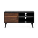 Front view of small TV unit in black wood with walnut door and two open shelves with cable holes