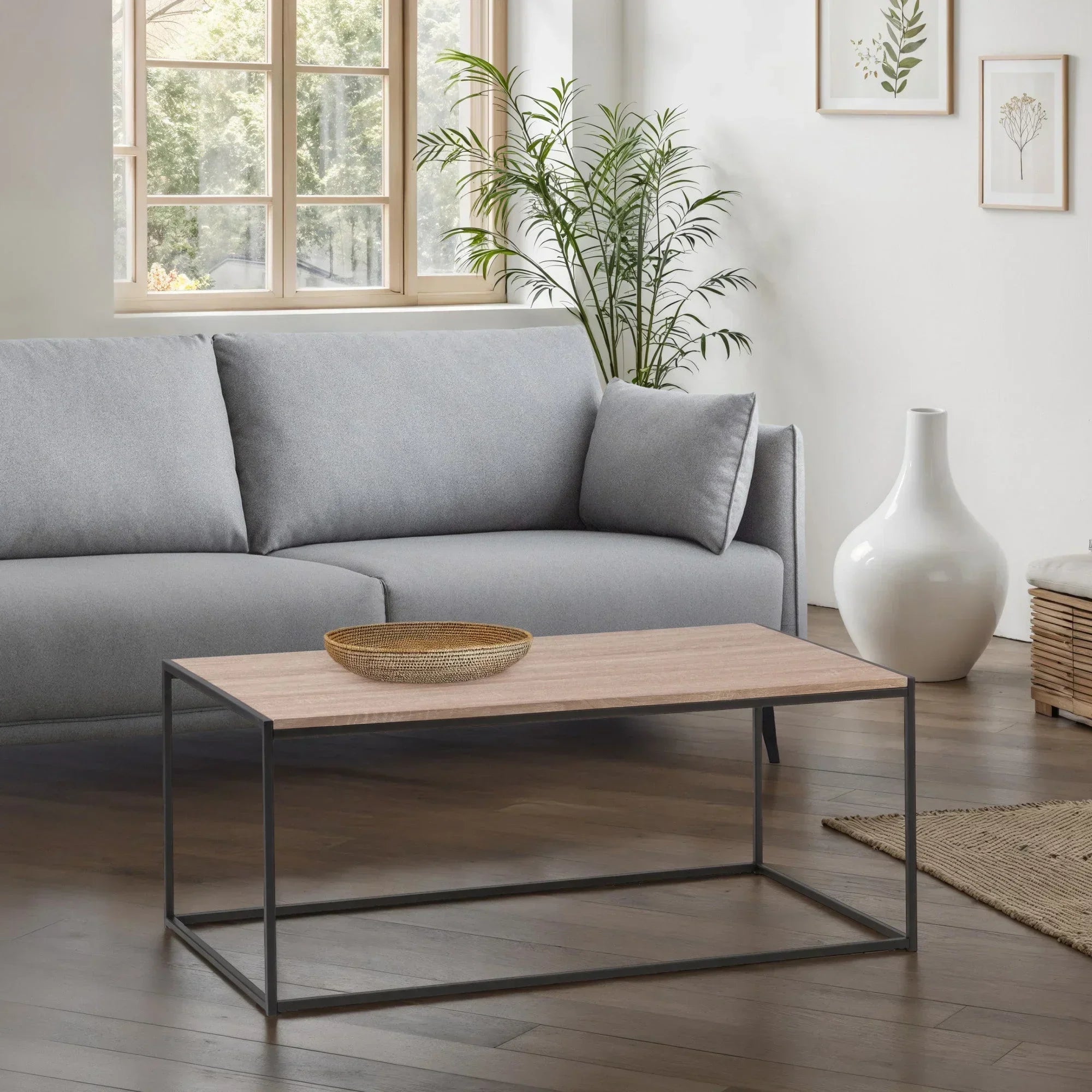 Rectangular wood coffee table with black metal frame in modern living room