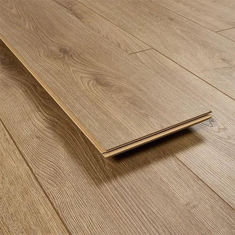 Tawny oak laminate flooring plank with wood grain texture on matching floor surface