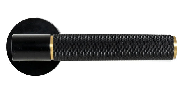 Matt black and brass door handle with textured grip, shown in side profile