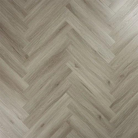 Urban grey wood flooring in herringbone pattern, close-up of textured laminate surface