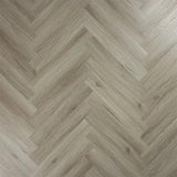 Urban grey wood effect flooring in herringbone pattern, close-up of textured surface