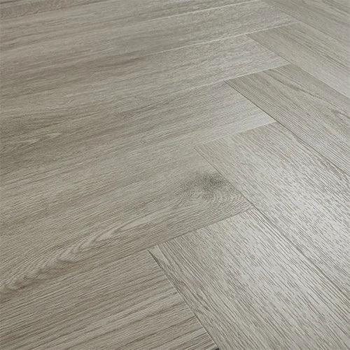 Urban grey wood effect flooring with textured grain pattern in herringbone layout