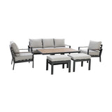 Grey outdoor sofa set with metal frame, matching armchairs, table, and cushioned stools