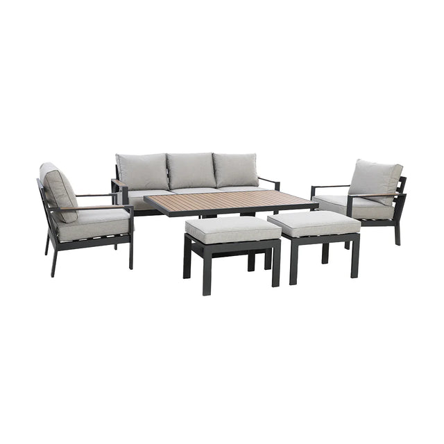 Grey outdoor sofa set with metal frame, matching armchairs, table, and cushioned stools