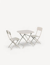 Folding bistro table and two chairs in light beige metal, shown on white background