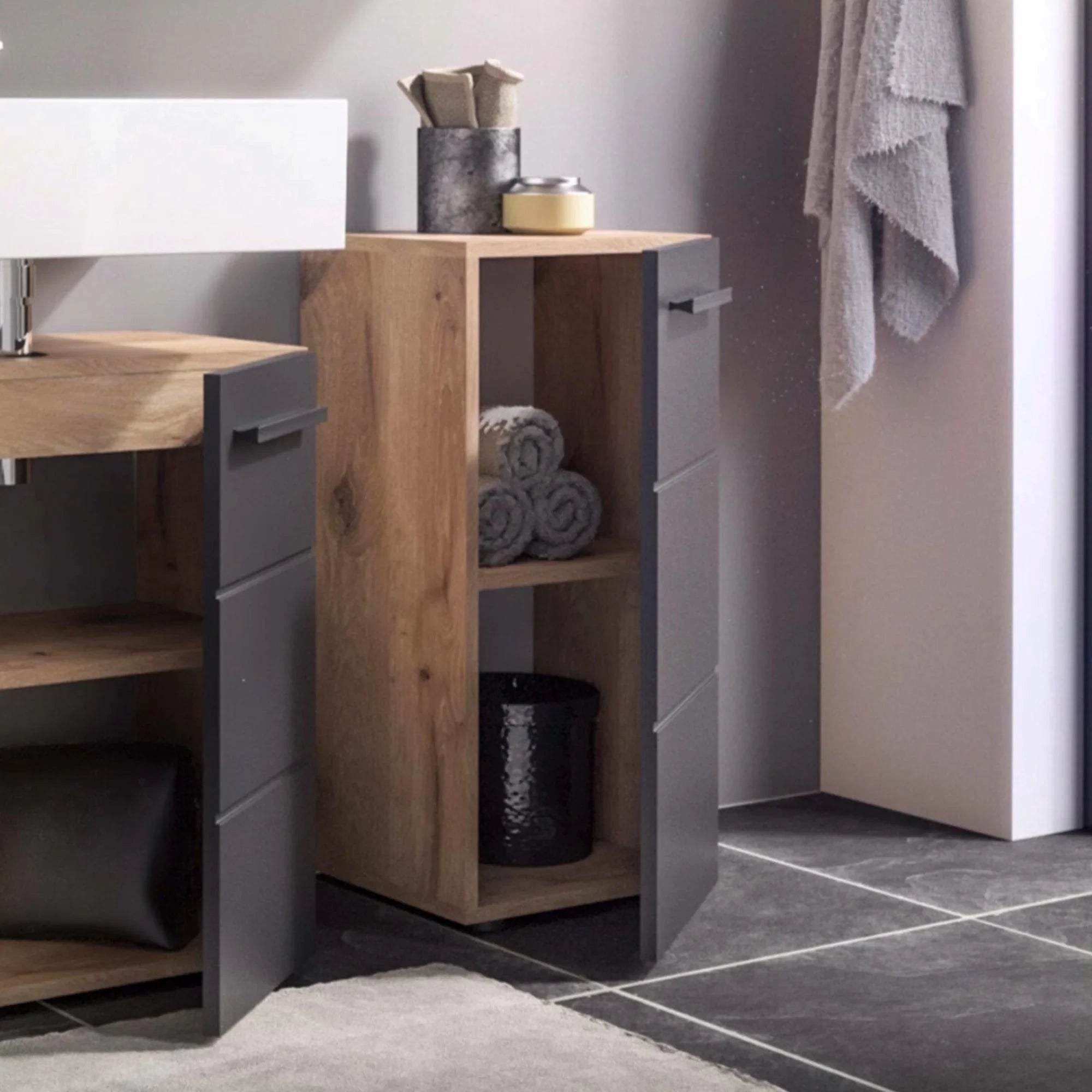 Modern oak and grey bathroom storage unit with open shelf and folded towels