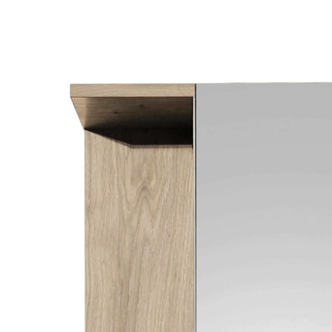 Closeup of wood wardrobe corner with oak finish and mirrored door panel