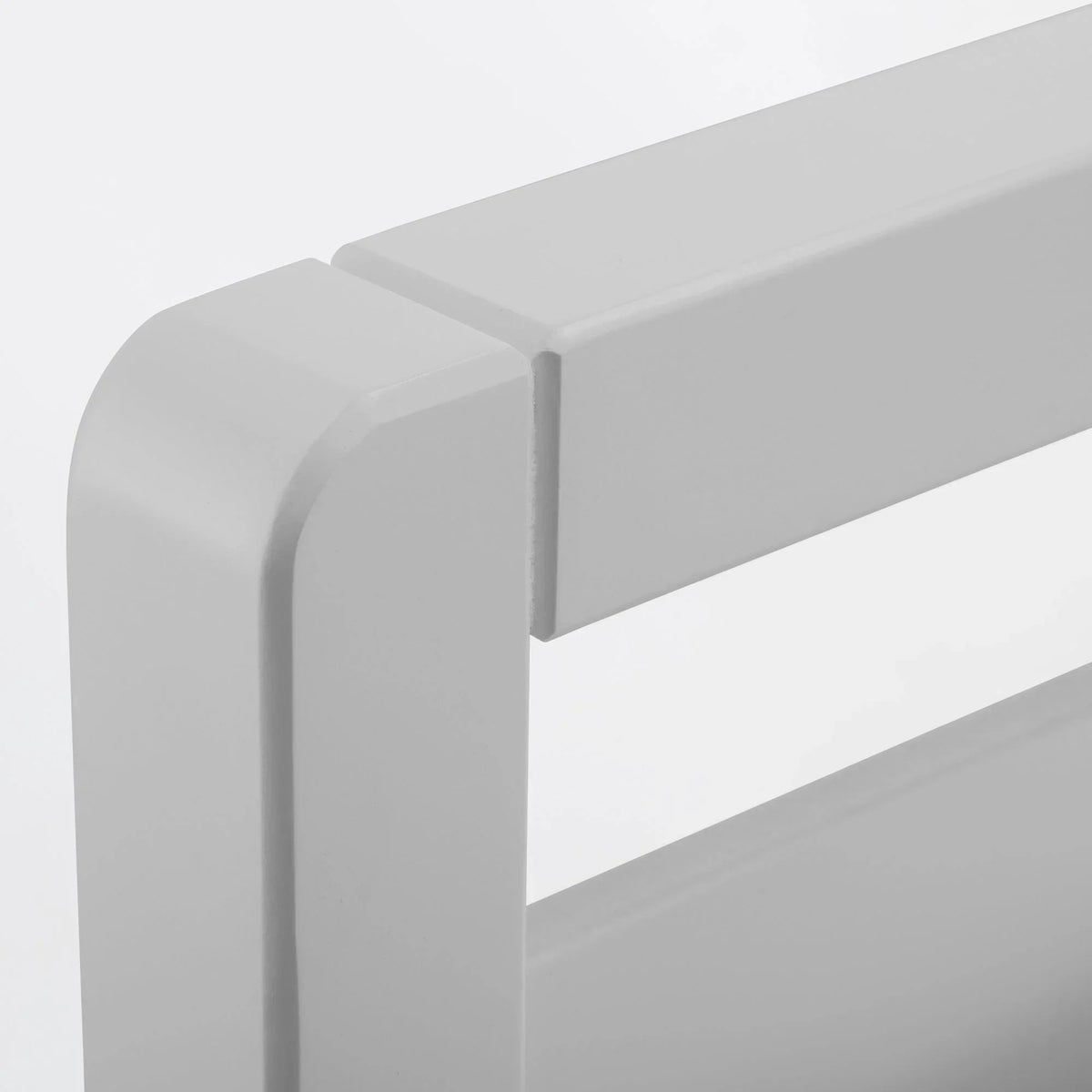 Dove grey bed frame corner detail with smooth painted wood finish