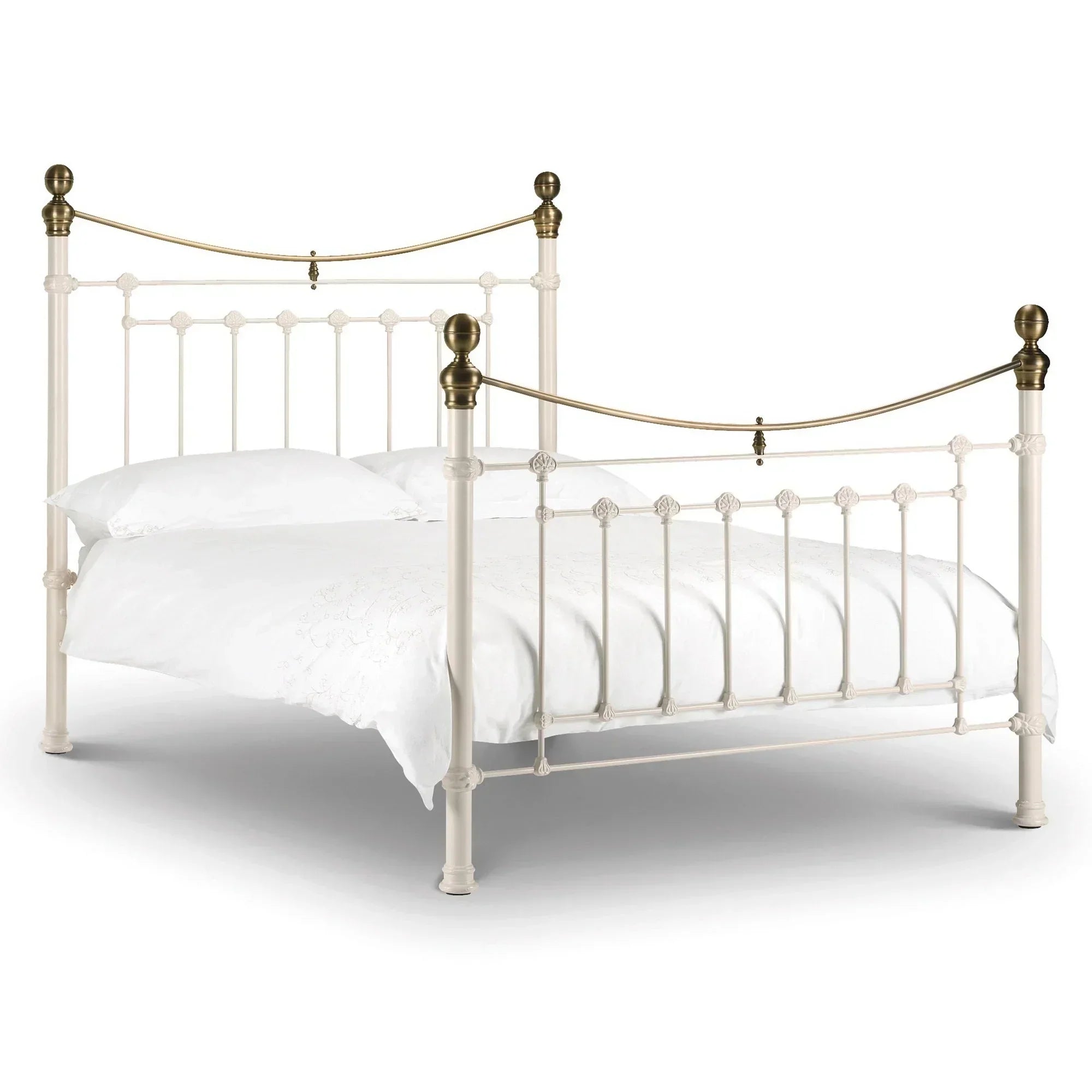 Stone white metal bed frame with brass finials and curved bars, shown with white bedding