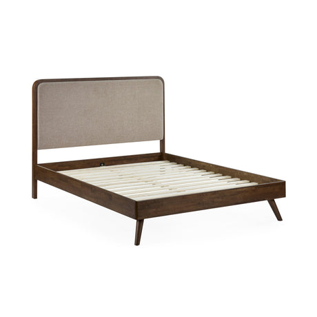 Walden bed frame with dark wood legs and beige upholstered headboard, no mattress, angled side view