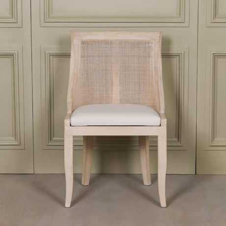 Light Wooden Sloped Rattan Upholstered Dining Chair in birch wood with a linen seat and natural finish
