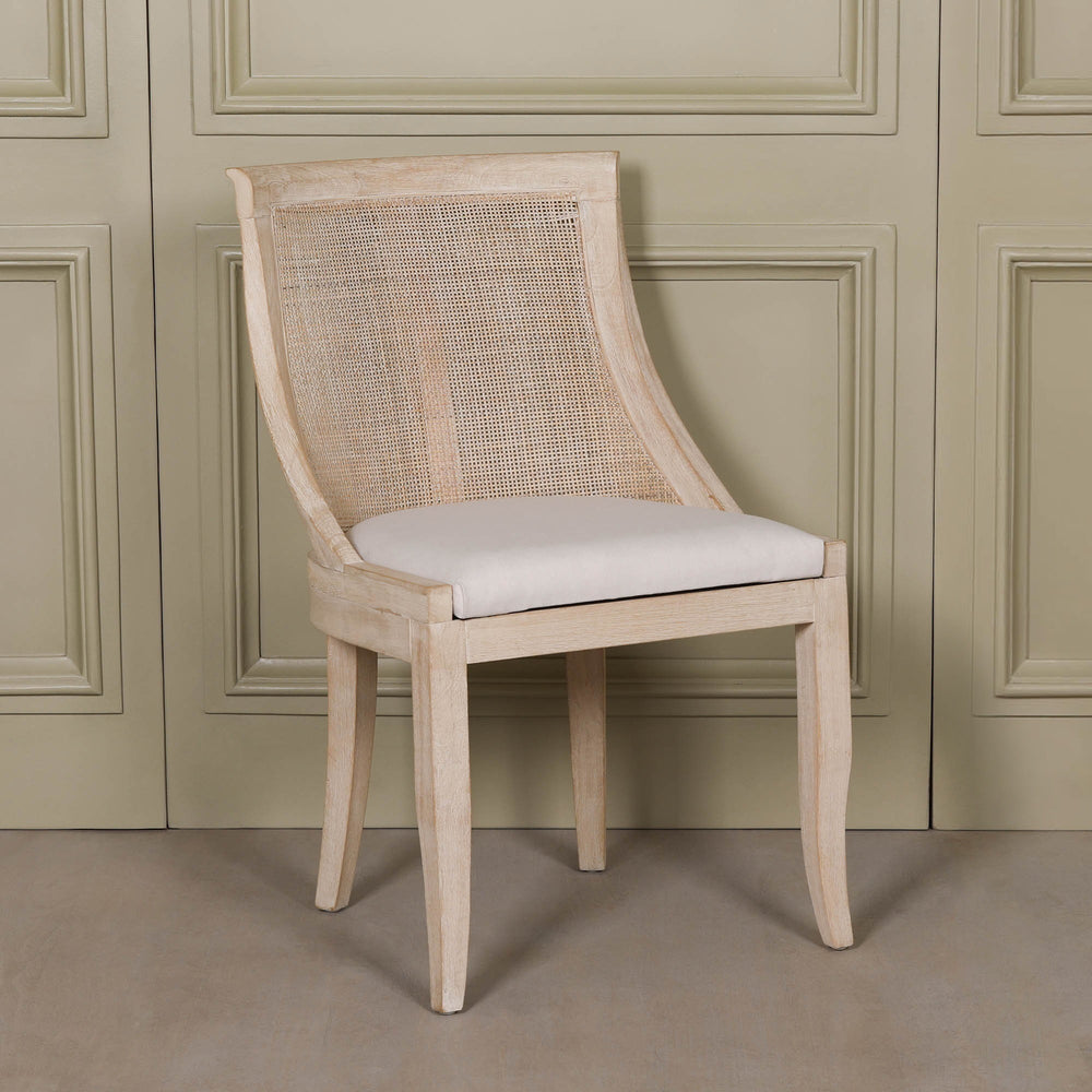 Light Wooden Sloped Rattan Upholstered Dining Chair with birch wood frame and linen seat in neutral tones