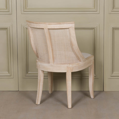 Light Wooden Sloped Rattan Upholstered Dining Chair with birch wood and linen in a natural finish